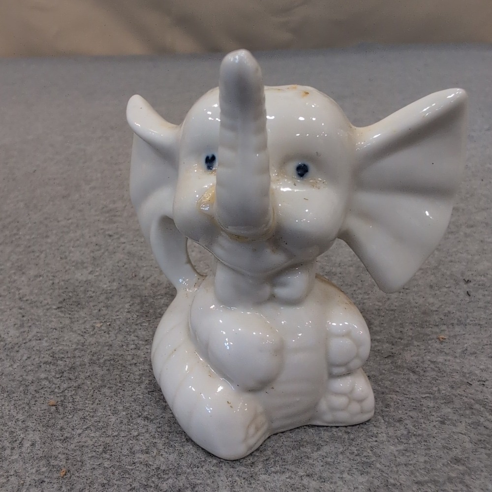 Vintage White Ceramic Elephant Figurine Seated Trunk Up Blue Eyes Bow Tie - Picture 1 of 4